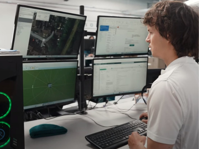 A Naked Solar designer building a system model at their desk
