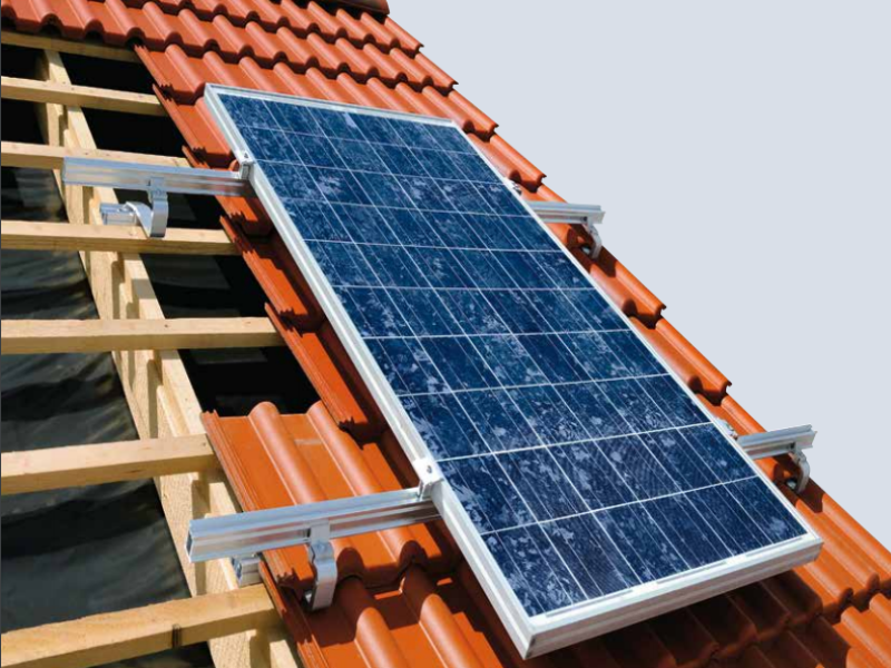 A solar panel is mounted on the roof of a house sale